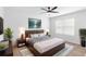 Comfortable main bedroom featuring a large window and stylish decor at 33436 Shutterfly Way, Sorrento, FL 32776