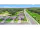 A row of single Gathering homes featuring well manicured lawns and brick paved driveways at 33436 Shutterfly Way, Sorrento, FL 32776