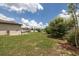 Expansive backyard with lush greenery, showcasing the outdoor living space and well-maintained lawn at 3810 Arboreal Ct, Deland, FL 32724