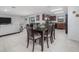 Open floor plan dining area with kitchen view, dining table, and living room access at 3810 Arboreal Ct, Deland, FL 32724