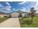 Well-maintained one-story home with a two-car garage, a cozy front yard, and a scenic view at 3810 Arboreal Ct, Deland, FL 32724