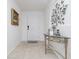 Welcoming foyer with tiled floors, decorative table, and a beautifully adorned wall at 3810 Arboreal Ct, Deland, FL 32724
