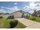 Charming single-Gathering home with a two-car garage, manicured lawn, and well-maintained landscaping at 3810 Arboreal Ct, Deland, FL 32724