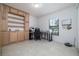 Bright office space with built-in shelving, desk, and natural light from the window at 3810 Arboreal Ct, Deland, FL 32724