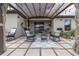 Inviting outdoor patio area with comfortable seating under a shaded pergola, perfect for relaxation at 3810 Arboreal Ct, Deland, FL 32724