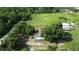 Expansive property featuring a cozy home, recreational vehicles and lush greenery at 396 Uranus Trl, Osteen, FL 32764