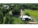 Wide open property with an array of mature trees and outbuildings, featuring a single Gathering home at 396 Uranus Trl, Osteen, FL 32764