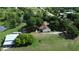 This property includes a home, outbuildings, ample parking, and expansive green space at 396 Uranus Trl, Osteen, FL 32764