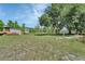 Expansive backyard with mature trees, storage shed and space for various activities at 396 Uranus Trl, Osteen, FL 32764