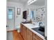 Bathroom with a vanity featuring a sink, and a large mirror and a partially visible toilet at 396 Uranus Trl, Osteen, FL 32764