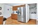Spacious kitchen showcasing stainless steel refrigerator and convenient laundry area at 396 Uranus Trl, Osteen, FL 32764
