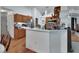 Charming kitchen with wood cabinetry, laminate floors, expansive counter space and an open layout at 396 Uranus Trl, Osteen, FL 32764