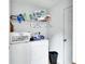 Efficient laundry room with washer, dryer, storage shelves and supplies at 396 Uranus Trl, Osteen, FL 32764