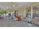 Patio with a ceiling fan, wicker furniture and an outdoor view at 396 Uranus Trl, Osteen, FL 32764