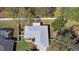 Aerial view of home showing roof, yard, and screened in pool at 413 Coventry Estates Blvd, Deltona, FL 32725