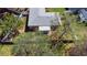 An aerial view of a home with a fenced yard featuring mature trees at 413 Coventry Estates Blvd, Deltona, FL 32725