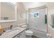 Bright bathroom featuring granite countertops, tub with shower, and updated fixtures at 413 Coventry Estates Blvd, Deltona, FL 32725