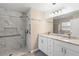 Bathroom features a walk-in shower and double vanity with granite countertops at 413 Coventry Estates Blvd, Deltona, FL 32725