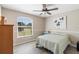 Well-lit bedroom with wood-look flooring and a ceiling fan at 413 Coventry Estates Blvd, Deltona, FL 32725