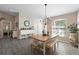 Inviting dining area with views into the kitchen and living room, featuring modern decor and ample natural light at 413 Coventry Estates Blvd, Deltona, FL 32725