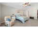 Inviting main bedroom with ensuite access, a ceiling fan, and a relaxed atmosphere in neutral tones at 413 Coventry Estates Blvd, Deltona, FL 32725