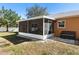The screened in porch offers great backyard views at 413 Coventry Estates Blvd, Deltona, FL 32725