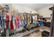 Functional walk-in closet with shelving and hanging racks, providing ample storage for clothing and accessories at 413 Coventry Estates Blvd, Deltona, FL 32725