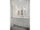 Bright bathroom with a custom vanity, quartz countertops, and modern lighting at 420 Greenridge Ct, Debary, FL 32713