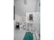 Bright bathroom with pedestal sink, glass-enclosed shower, and tiled floors at 420 Greenridge Ct, Debary, FL 32713