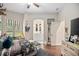Stylish bedroom with hardwood floors and a view into the bathroom at 420 Greenridge Ct, Debary, FL 32713