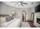 Comfortable primary bedroom boasts fireplace, view to the foyer, and lots of room to stretch out and relax at 420 Greenridge Ct, Debary, FL 32713