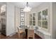 Cozy breakfast nook with shuttered windows, a modern light fixture, and built-in bench seating at 420 Greenridge Ct, Debary, FL 32713