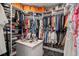 Spacious walk-in closet with ample storage, custom shelving, and marble countertop island at 420 Greenridge Ct, Debary, FL 32713
