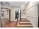 Elegant entryway featuring hardwood floors, decorative trim, and a staircase at 420 Greenridge Ct, Debary, FL 32713