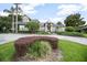 Stately home featuring a circular driveway, manicured landscaping, and lush green lawn at 420 Greenridge Ct, Debary, FL 32713