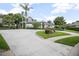 Elegant home with a circular driveway and meticulously landscaped front yard at 420 Greenridge Ct, Debary, FL 32713