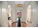 Elegant foyer features an orchid centerpiece and views into the living spaces of this open floor plan home at 420 Greenridge Ct, Debary, FL 32713