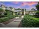 Charming home featuring lush landscaping, inviting walkway, and elegant architectural details at 420 Greenridge Ct, Debary, FL 32713