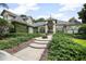 Charming home featuring lush landscaping, inviting walkway, and elegant architectural details at 420 Greenridge Ct, Debary, FL 32713