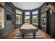 Stylish game room with a pool table, large windows, and a mounted TV, perfect for entertainment at 420 Greenridge Ct, Debary, FL 32713