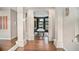 Elegant game room featuring a pool table, hardwood floors, and abundant natural light from large windows at 420 Greenridge Ct, Debary, FL 32713