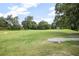 Expansive golf course view showcasing lush greenery and mature trees at 420 Greenridge Ct, Debary, FL 32713