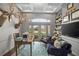 Bright and inviting living room boasts French doors to a balcony, comfortable seating, and plenty of natural light at 420 Greenridge Ct, Debary, FL 32713