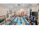 Large playroom with toys, rocket tent, and dark hardwood flooring at 420 Greenridge Ct, Debary, FL 32713
