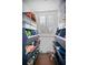 Organized toy storage with shelving and window with plantation shutters at 420 Greenridge Ct, Debary, FL 32713