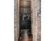 Custom wine rack built into a brick alcove with multiple storage levels at 420 Greenridge Ct, Debary, FL 32713