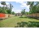 Spacious backyard featuring a well-maintained lawn and privacy fence at 429 W Carolina Ave, Deland, FL 32720