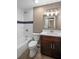 Bathroom featuring a shower/tub combo, and a dark wood vanity with white countertop at 429 W Carolina Ave, Deland, FL 32720