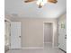 Bedroom with neutral walls and trim, showing both the entry door and a walk-in closet at 429 W Carolina Ave, Deland, FL 32720