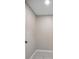 Walk-in closet featuring tile flooring and neutral walls at 429 W Carolina Ave, Deland, FL 32720
